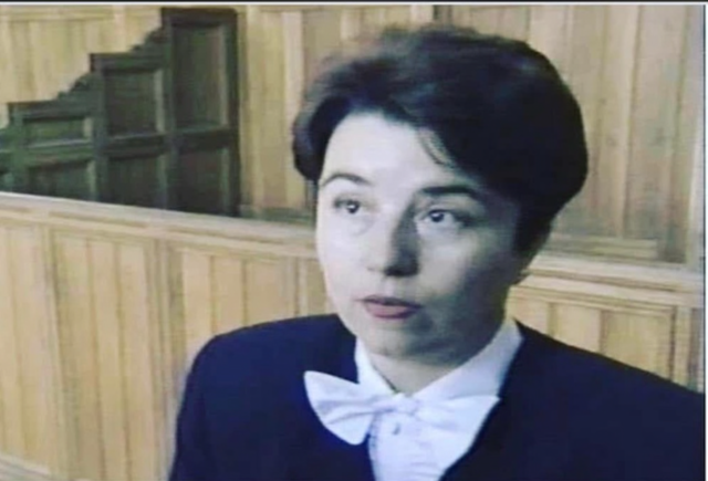 Virginia Prodan in formal attire in a Romanian courtroom.